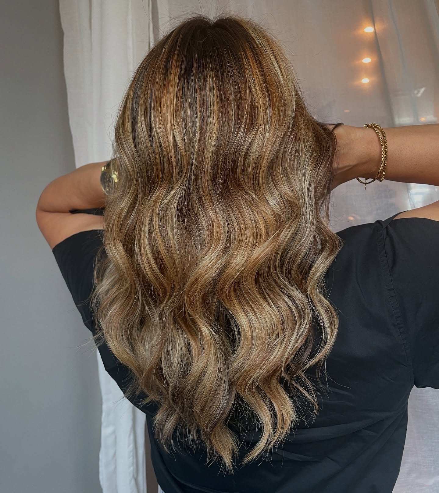 Client running fingers through freshly colored, dimensional waves.